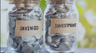 Jars labeled Savings and Investment